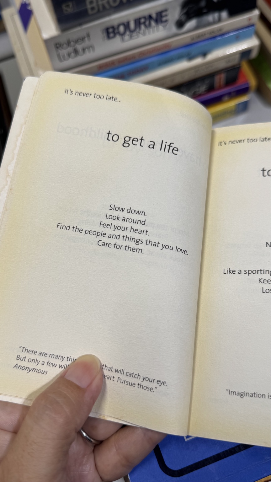 An open book showing the heading 'to get a life'